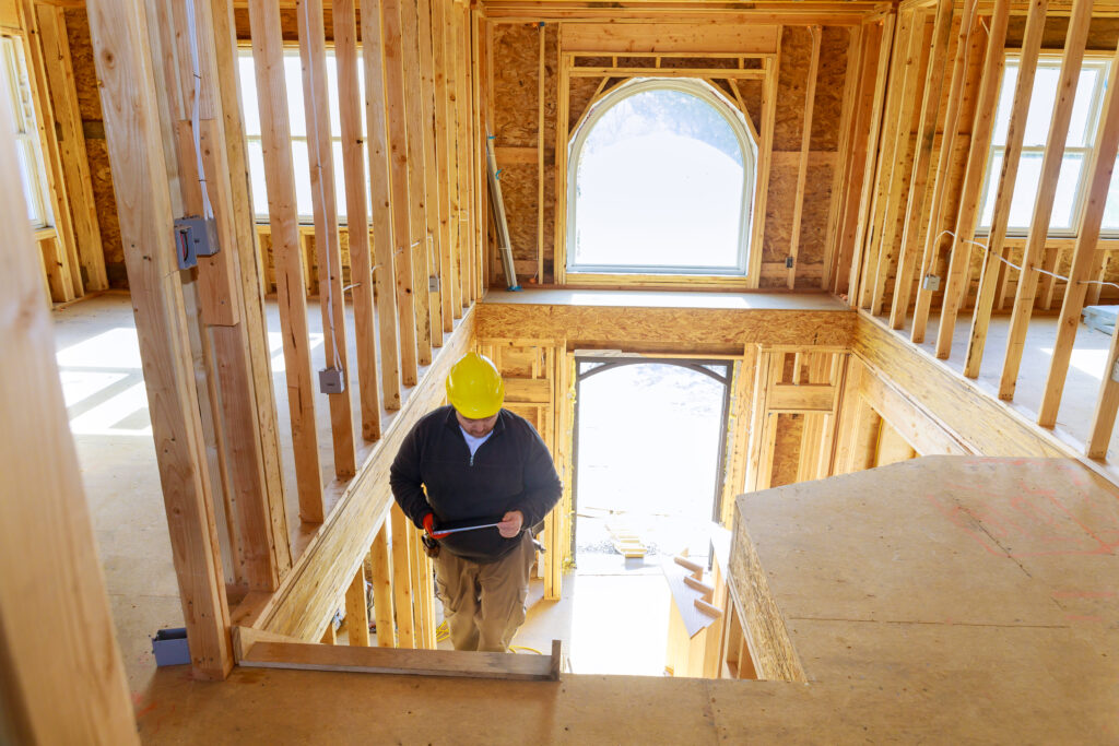 Builder work profit margin comparison: new production homes under construction with arch window