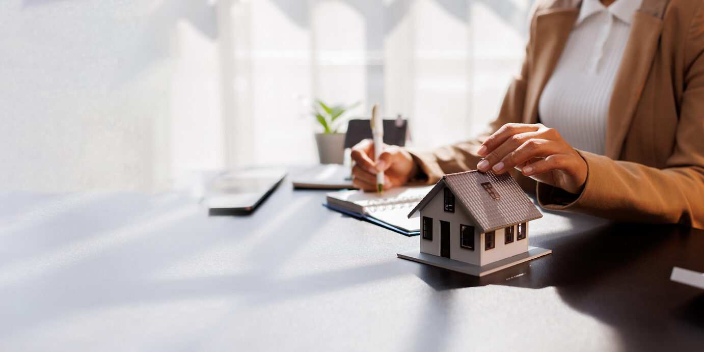 Real Estate Broker agent's signature on the contract finalized the mortgage agreement, marking a significant investment in the housing property for business purposes. Homework